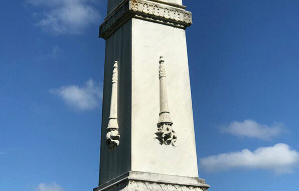 What does a torch on a gravestone mean