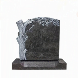 Carved granite tombstone in tree trunk shape